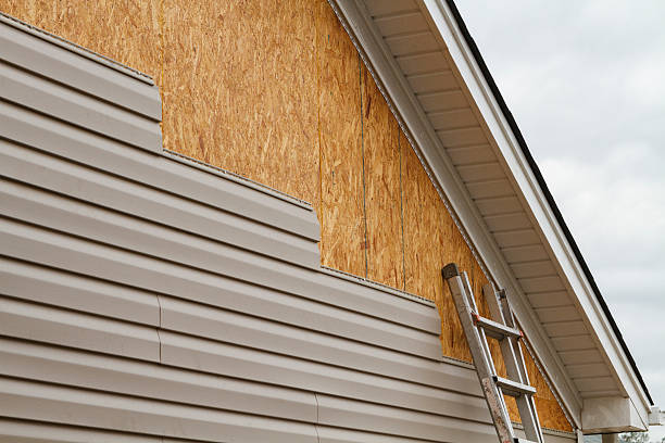 Professional Siding Replacement technician working in Long Beach, IN